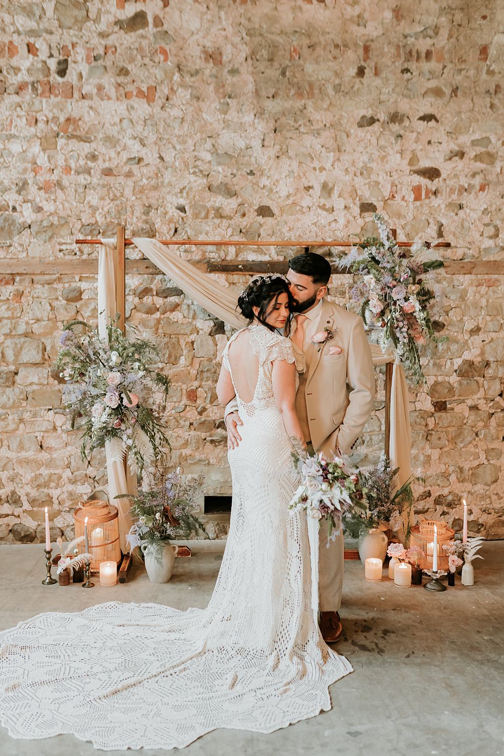 Beige Barn Boho Wedding Gabrielas Photography and Film Backdrop Arch Flowers Drapes Candles