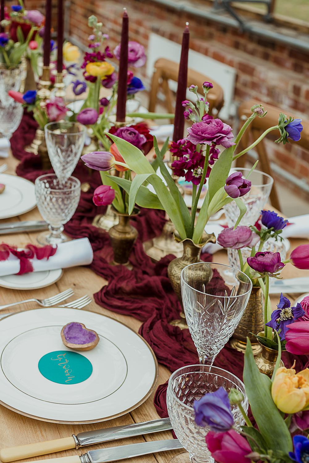 Somersbury Barn Wedding Thorn and Found Flowers Candles Table Decor Green Red Purple Blue Gold