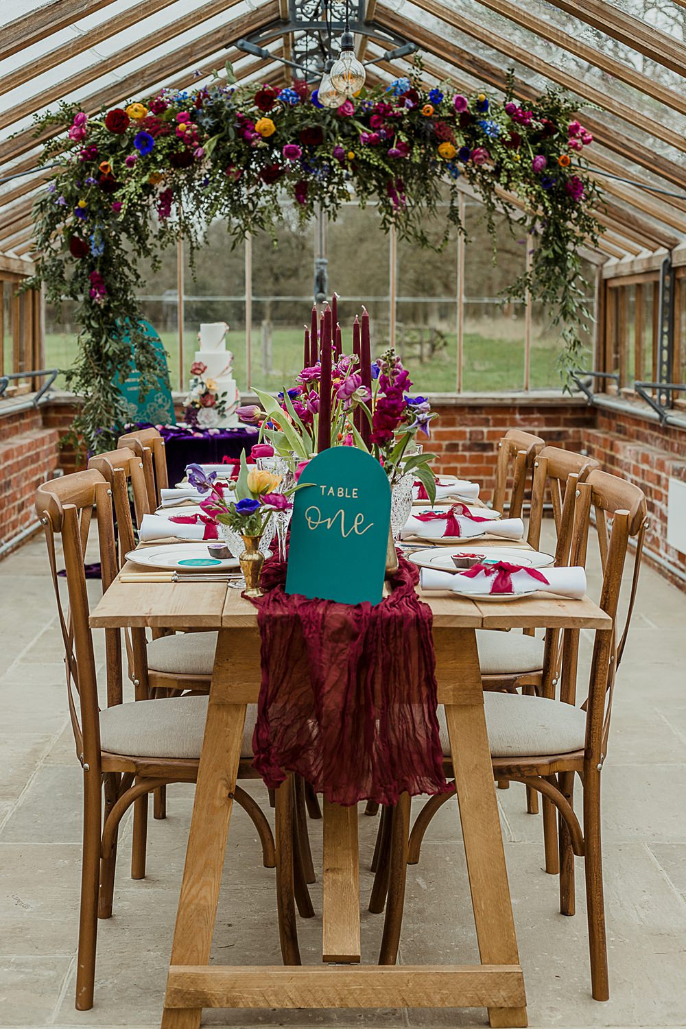 Somersbury Barn Wedding Thorn and Found Flowers Candles Table Decor Green Red Purple Blue Gold