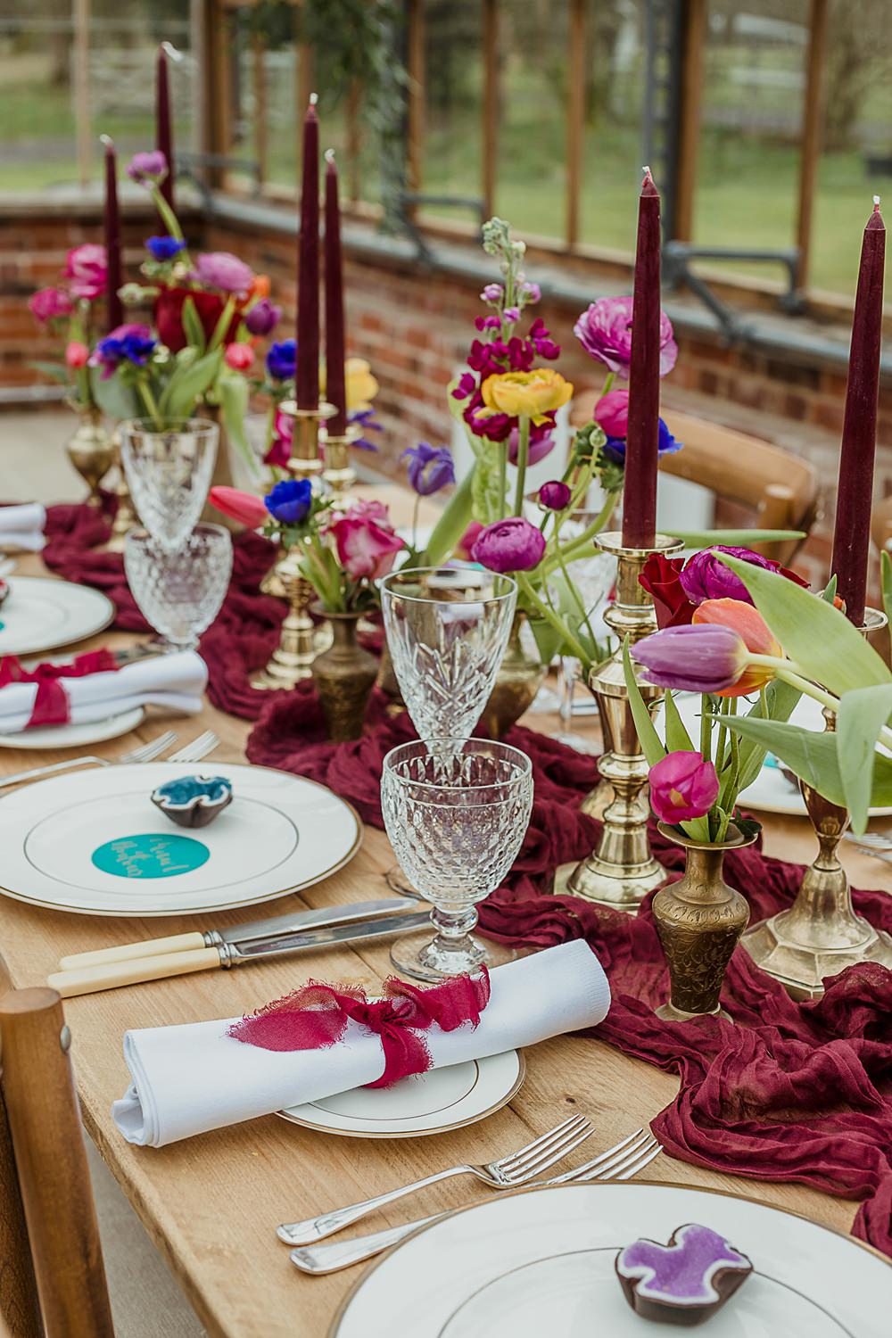 Somersbury Barn Wedding Thorn and Found Flowers Candles Table Decor Green Red Purple Blue Gold