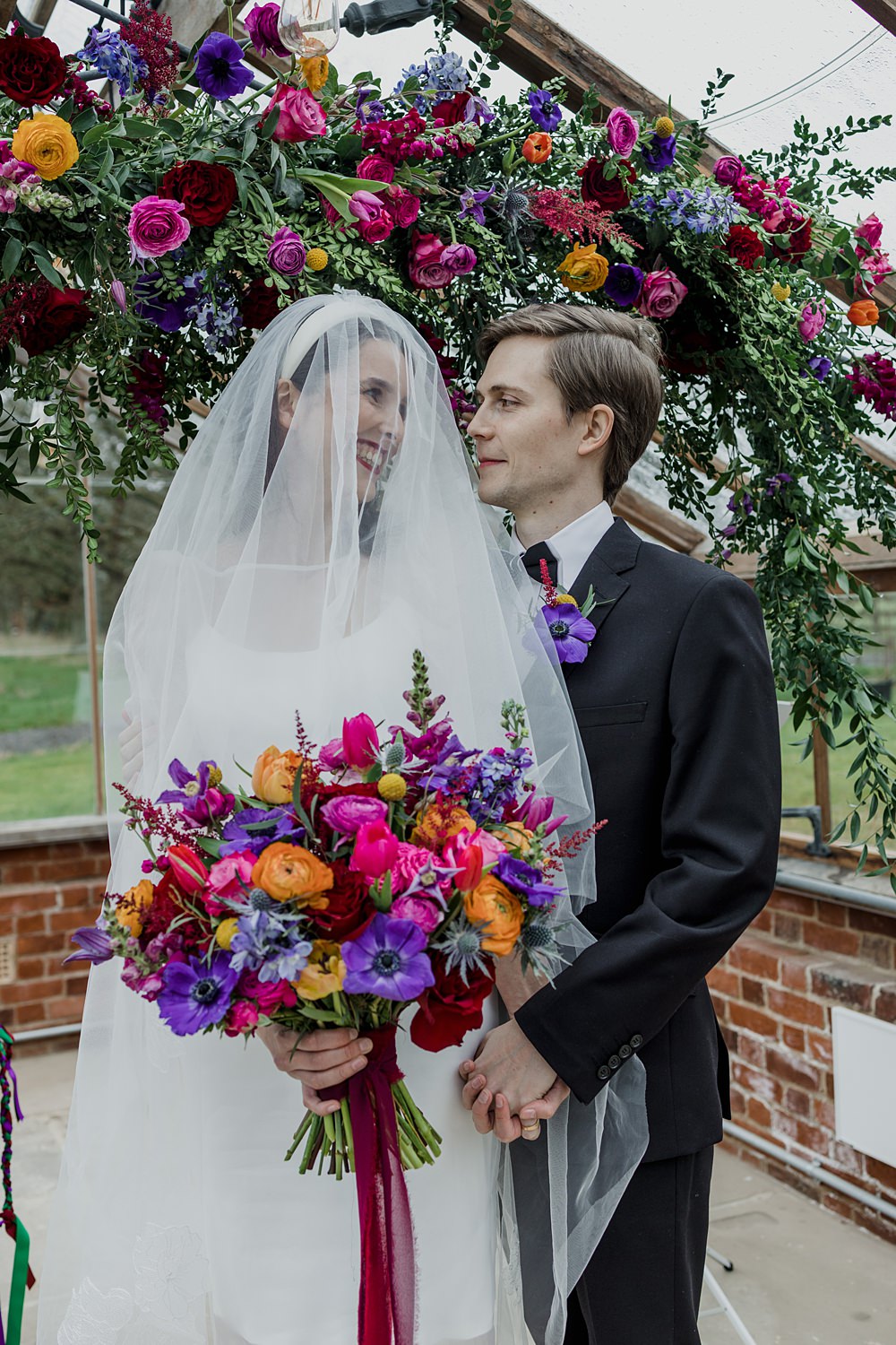 Somersbury Barn Wedding Tyler Rook Photography Flower Arch Colourful