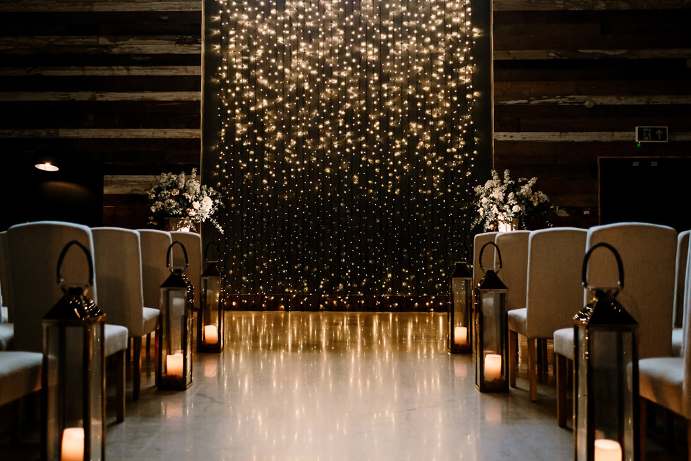 Ceremony Aisle Candles Fairy Light Wall Stylish Yorkshire Barn Wedding Hayley Baxter Photography