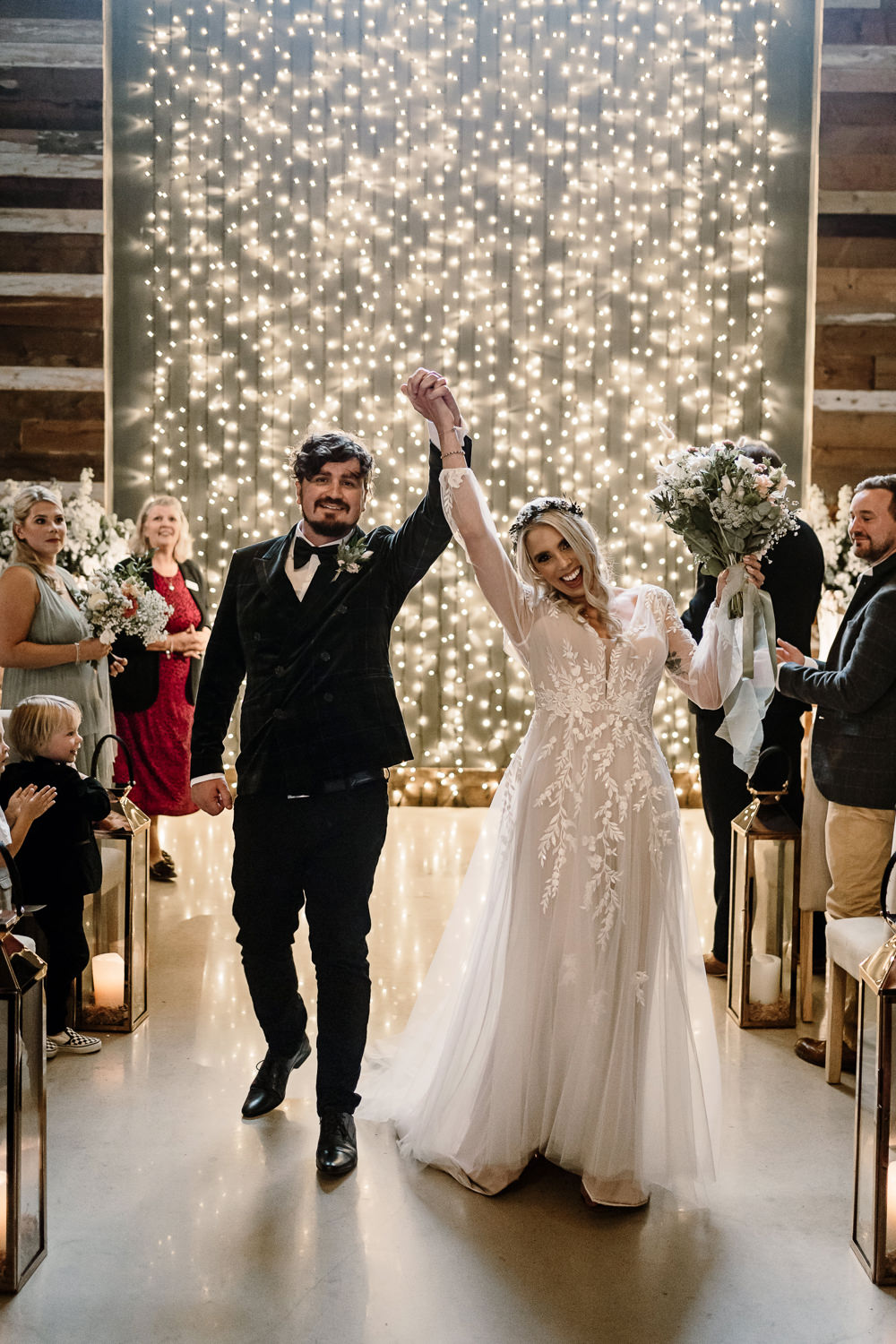 Ceremony Aisle Candles Fairy Light Wall Stylish Yorkshire Barn Wedding Hayley Baxter Photography