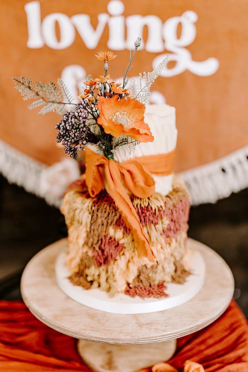 Shag Texture Cake Orange 70s Retro Ribbon Flowers Daisy Jones Six Wedding Ideas Caroline Opacic Photography