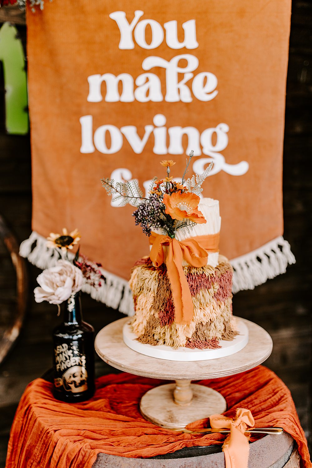 Shag Texture Cake Orange 70s Retro Ribbon Flowers Table Daisy Jones Six Wedding Ideas Caroline Opacic Photography