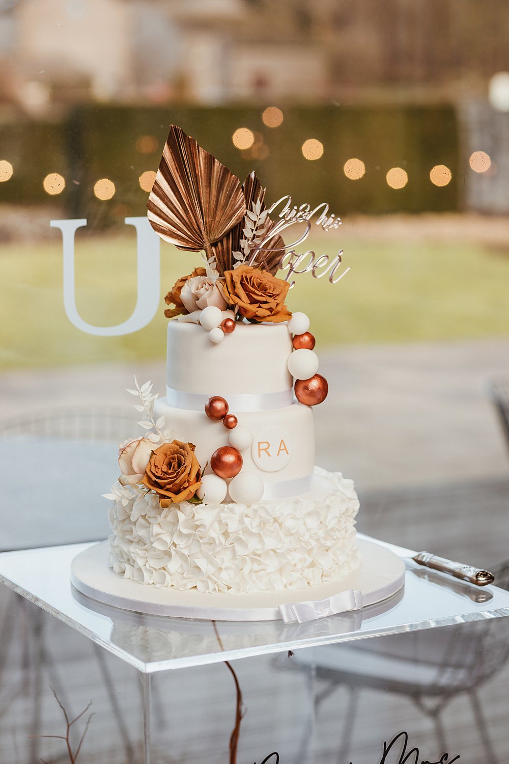 White Cake Orange Flowers Ruffle 3 Tier Broughton Sanctuary Wedding Photography34