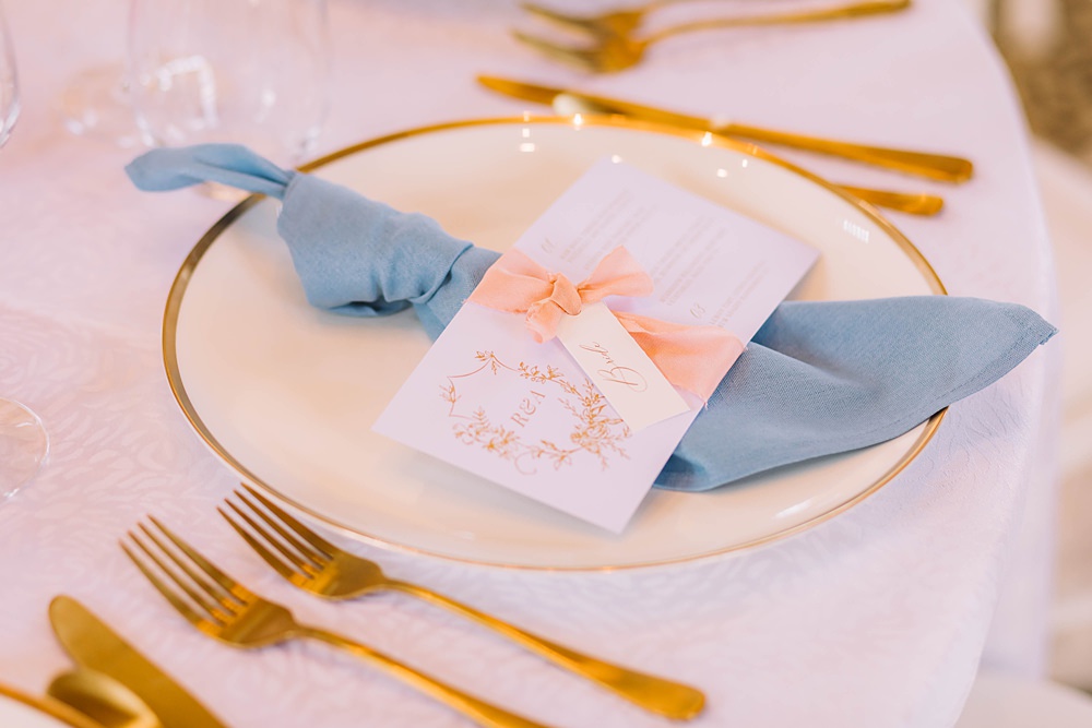 Place Setting Blue Napkin Name Tag Ribbon Gold Cutlery Williamson Park Wedding Samantha Broadley Photography