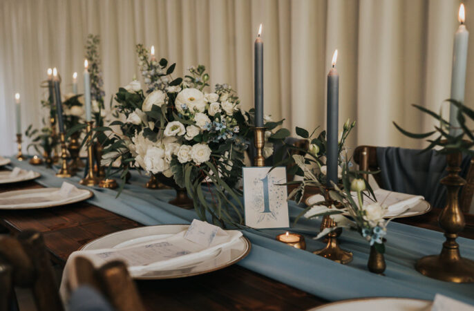 Winter Wedding Centrepiece Table Decorations Blue Brass Greenery Ideas SJP Photography