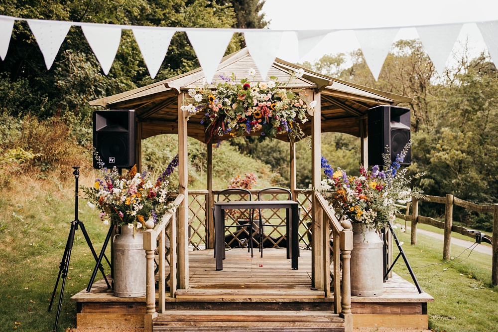 Flowers Bunting Decor Pagoda Wedding Ceremony Holly Collings Photography