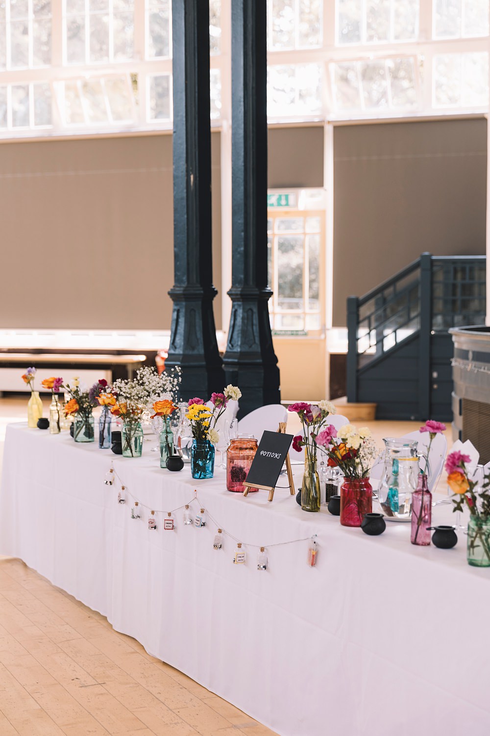 Top Table Flowers Bottles Pavilion Gardens Buxton Wedding Lauren Elliott Photography