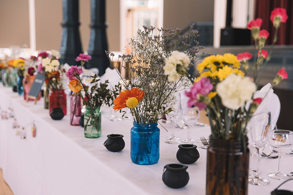 Top Table Colourful Flowers Bottles Pavilion Gardens Buxton Wedding Lauren Elliott Photography