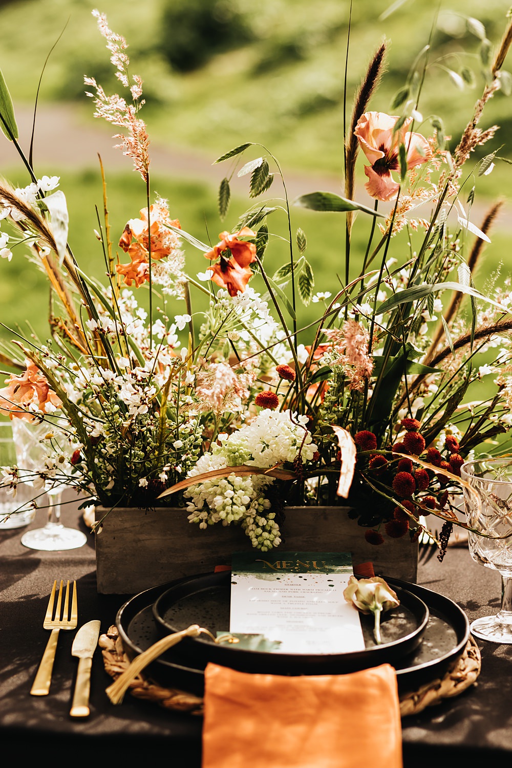 Place Setting Black Plate Rattan Place Mat Table Flowers Rust Green Wedding Ideas Julie Clarke Photography