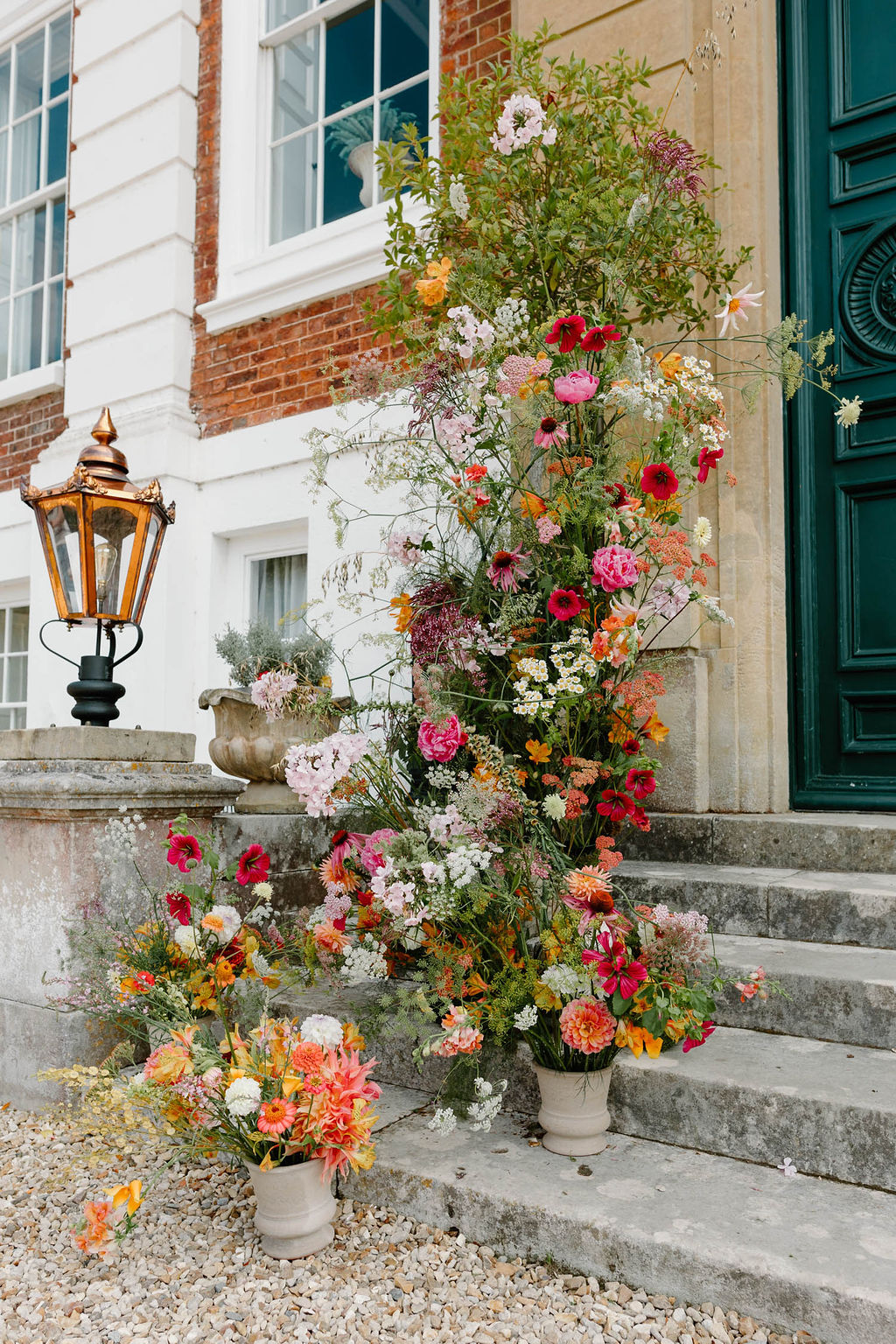 Entrance Doorway Flower Pillar Arrangement Pink Orange Yellow Wedding Ideas Mimosa Photography