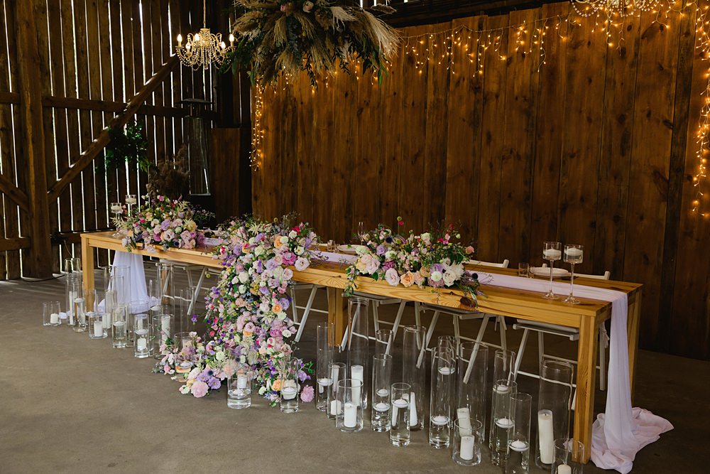 Decor Table Flowers Pink Candles Fairy Lights Poland Barn Wedding Matt and Lena Photography