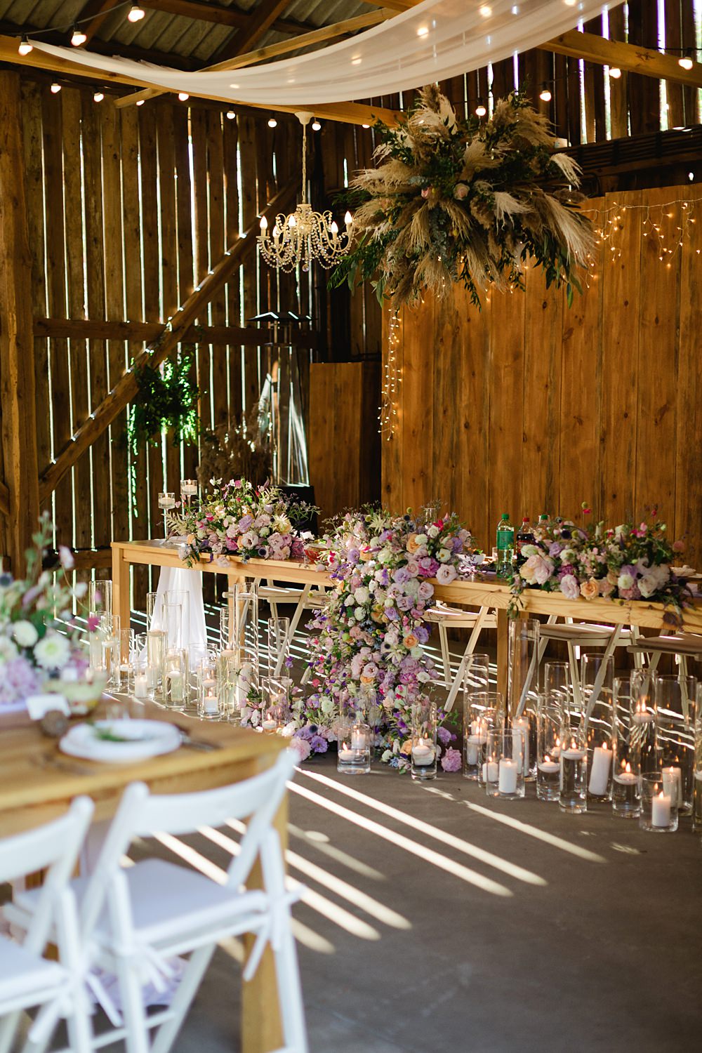 Decor Table Flowers Pink Candles Fairy Lights Poland Barn Wedding Matt and Lena Photography
