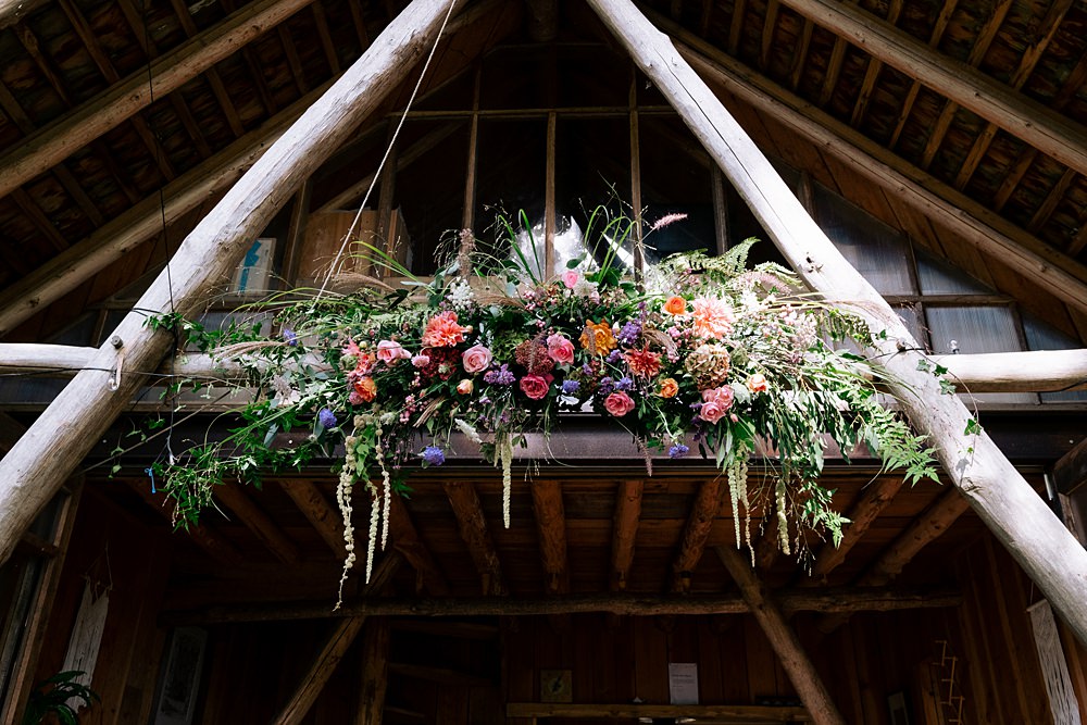 Wilderness Wood Wedding Kerrie Wood Photography Colourful Ceremony Flower Hanging Cloud