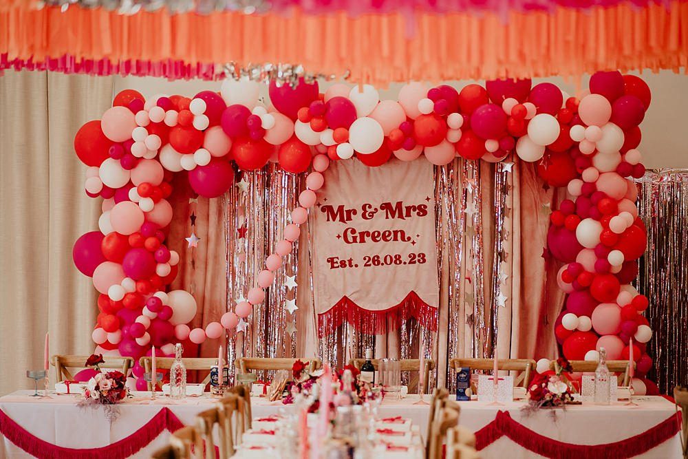 70s Disco Wedding Bubear Photography Top Table Banner Balloons Tassels Pink Red