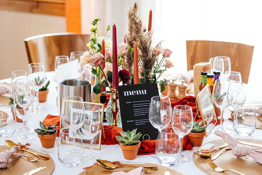 Bassmead Manor Barns Wedding Two-D Photography Centrepiece Flowers Candles Mini Pot Plants