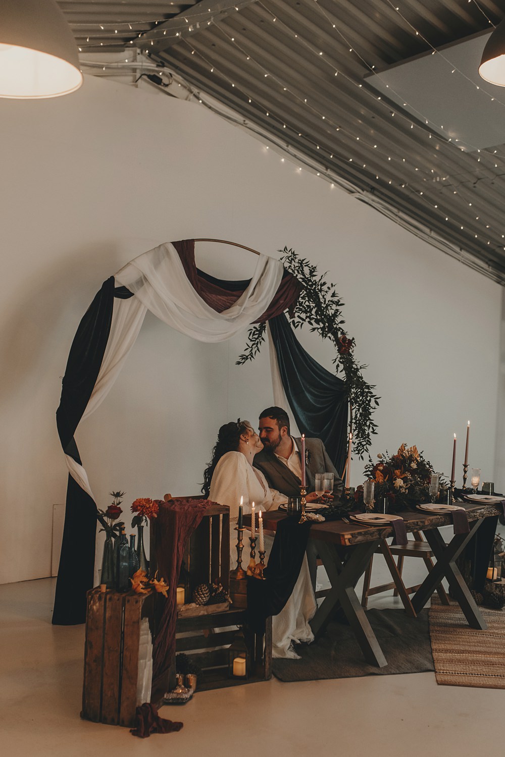 Celestial Witchy Winter Wedding Ideas Aurora Photographic Black White Drapes Hoop Greenery Table Backdrop