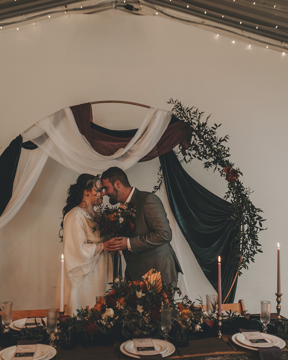 Celestial Witchy Winter Wedding Ideas Aurora Photographic Black White Drapes Hoop Greenery Table Backdrop