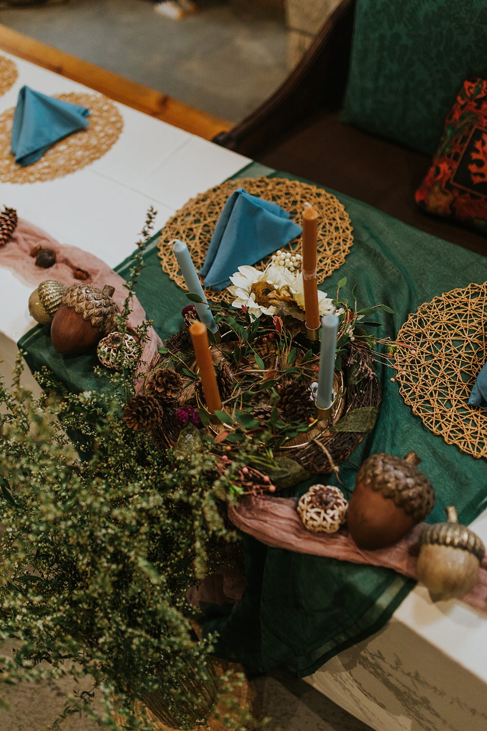 Scout Camp Wedding Rachael Marie Photography Centrepiece Decor Blue Linen Rattan Placemat Dried Flowers Candles Acorns