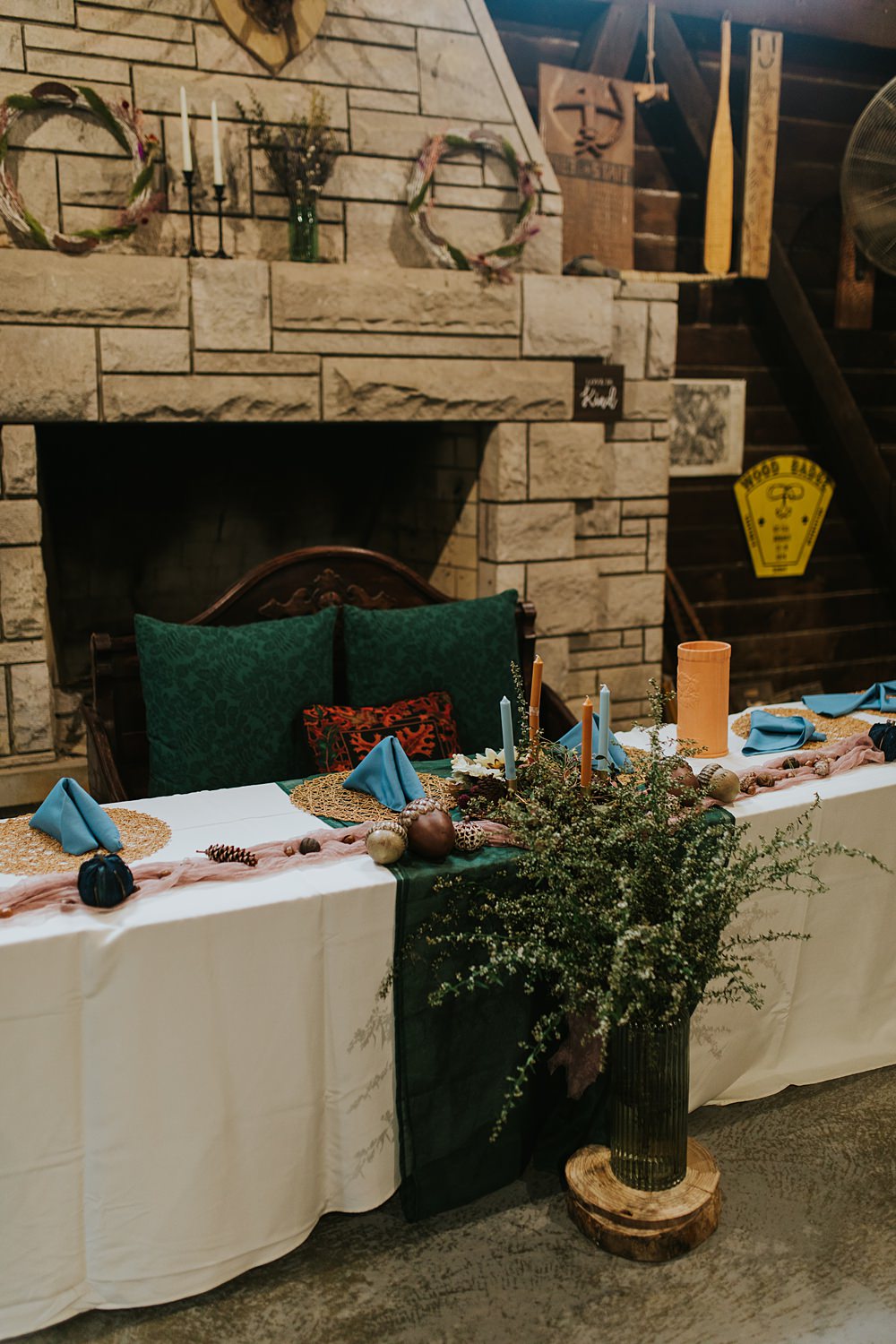 Scout Camp Wedding Rachael Marie Photography Centrepiece Decor Blue Linen Rattan Placemat Dried Flowers Candles Acorns