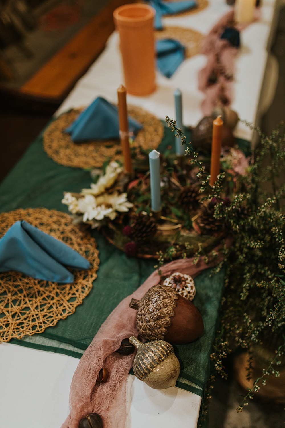 Scout Camp Wedding Rachael Marie Photography Centrepiece Decor Blue Linen Rattan Placemat Dried Flowers Candles Acorns