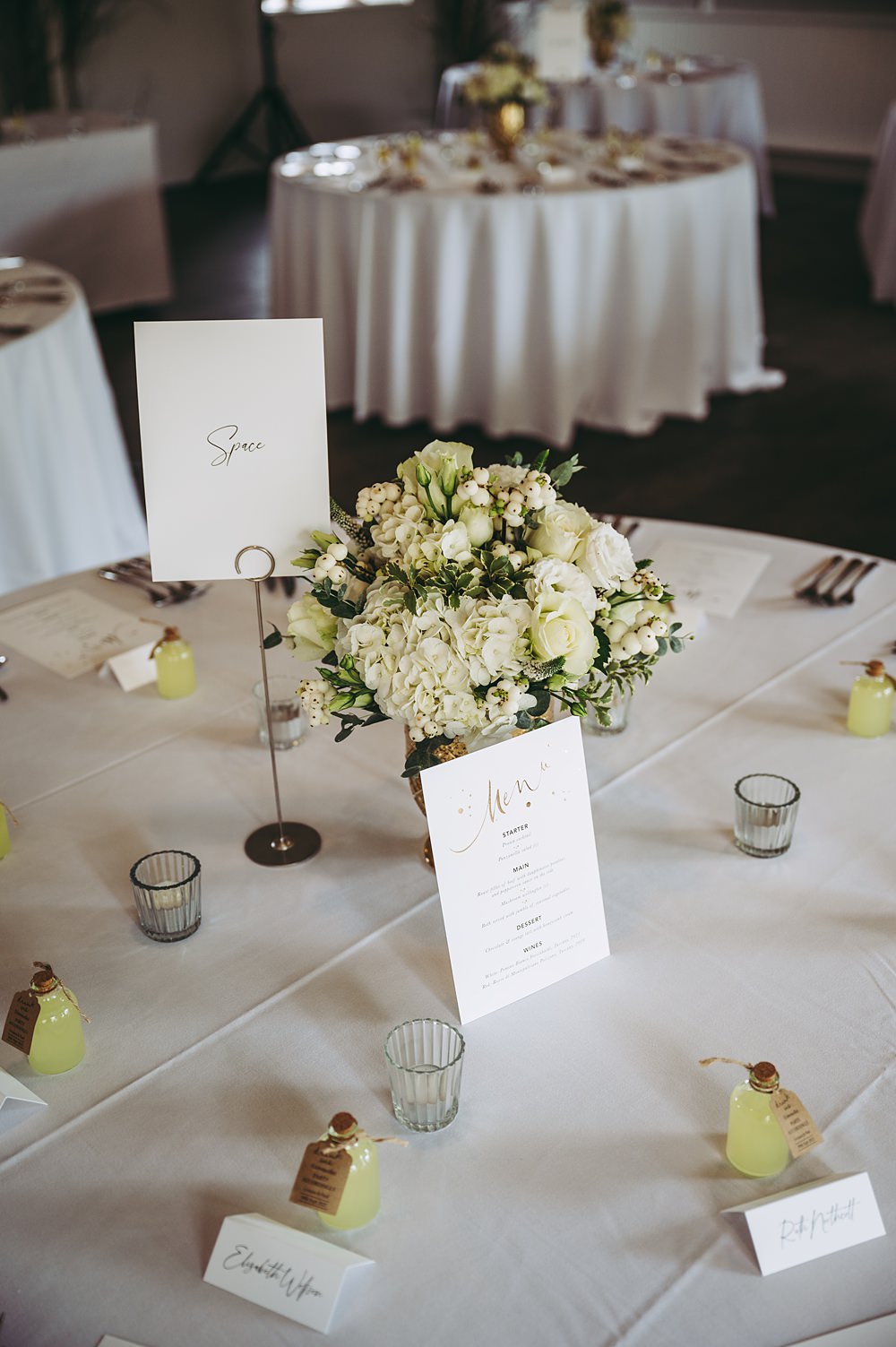 White Gold Wedding Cotswold Pictures Flowers Rose Greenery Tea Lights Round Table Centrepiece