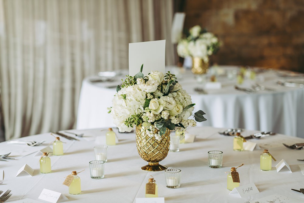 White Gold Wedding Cotswold Pictures Flowers Rose Greenery Tea Lights Round Table Centrepiece