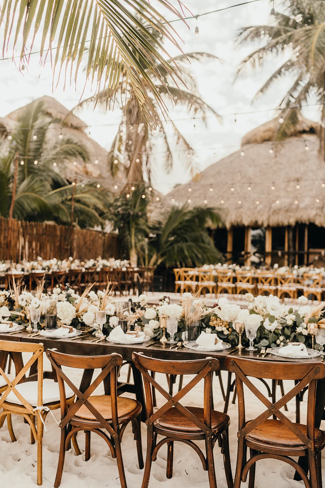 Akiin Tulum Wedding Beach Kape Photography Long Wooden Table White Flowers Pampas Grass Runner Black Candles Festoon Lights