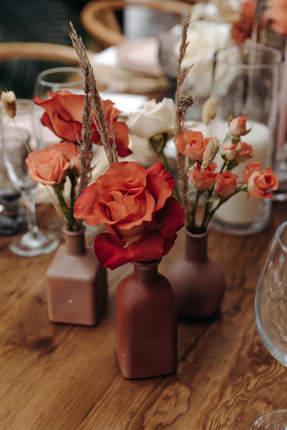 Aldea Ka'an Tulum Wedding Bamba Photography Rose Flowers Bottles Centrepiece Orange Red