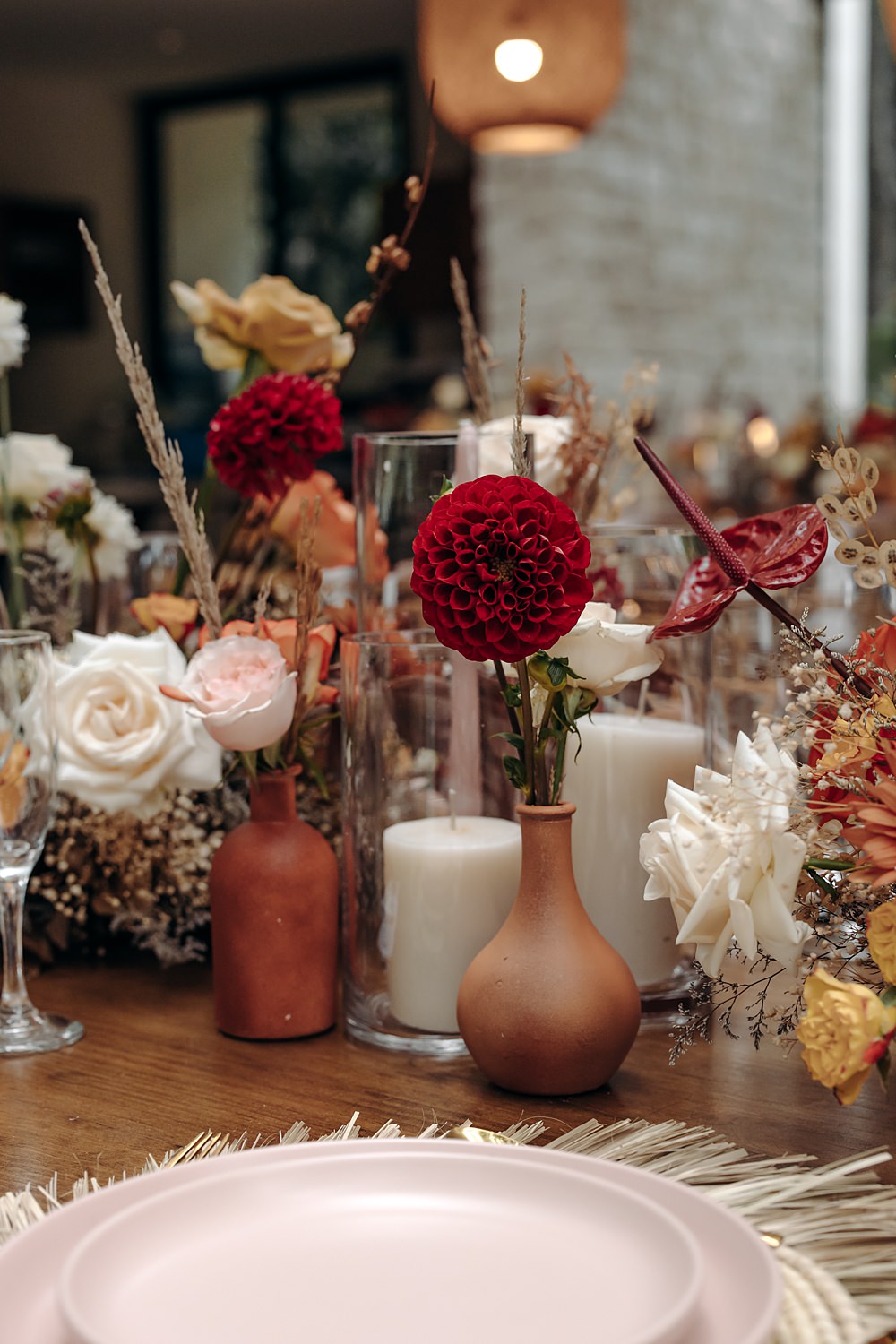Aldea Ka'an Tulum Wedding Bamba Photography Rose Flowers Bottles Centrepiece Orange Red