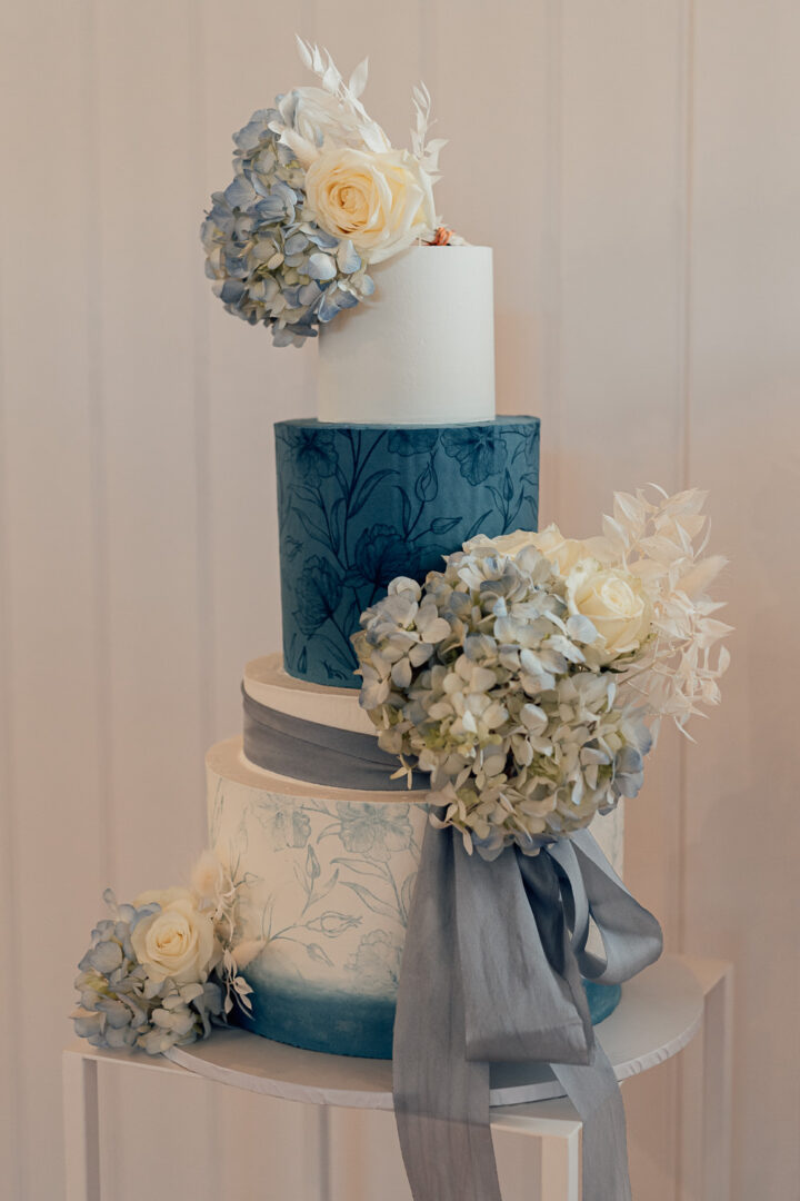 Blue White Painted Flowers Spring Wedding Cake Clare Smith Photography