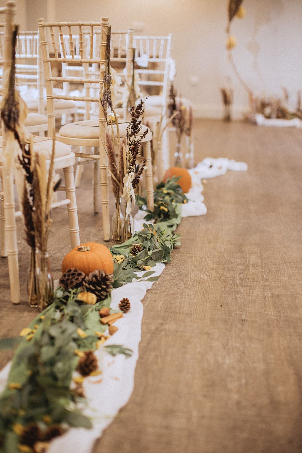 Conwy Barn Wedding Fox and Bear Photography Aisle Pew End Pumpkin Fabric Greenery Pine Cones