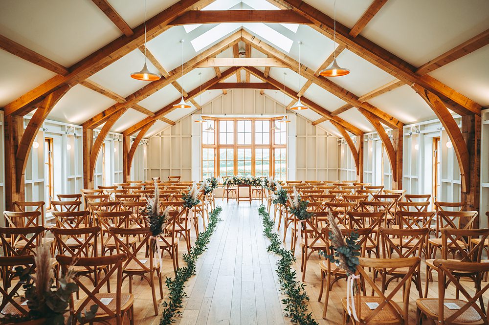 Hyde House Wedding Cotswold Pictures Modern Barn Ceremony Greenery Aisle Flowers Decor
