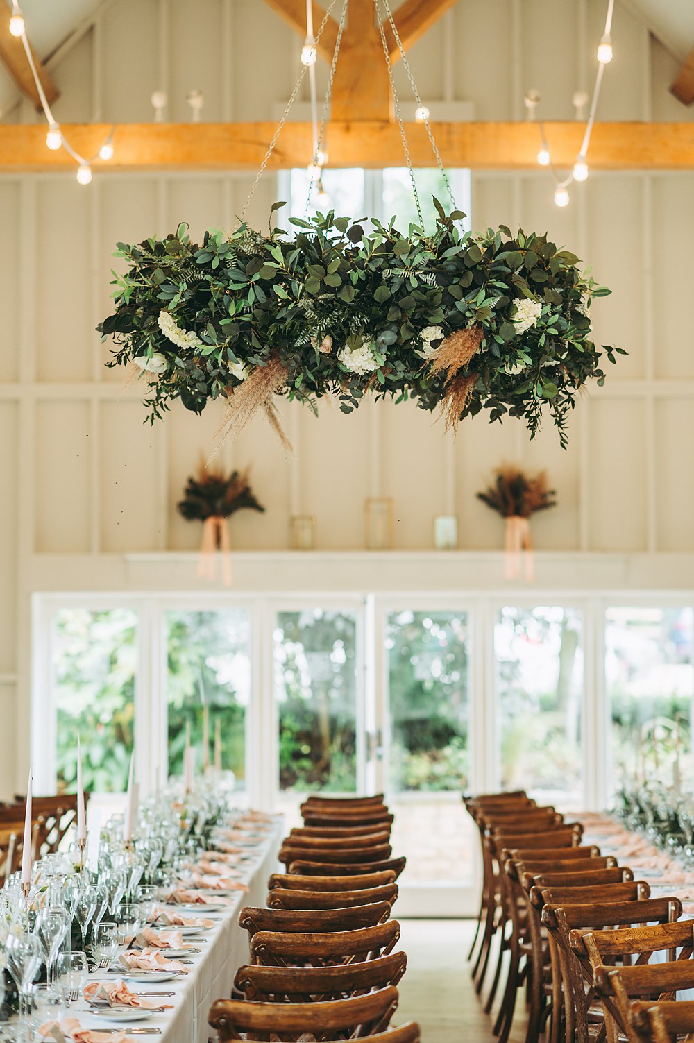 Hyde House Wedding Cotswold Pictures Modern Barn Long Wooden Tables Hanging Greenery Hoop Decor