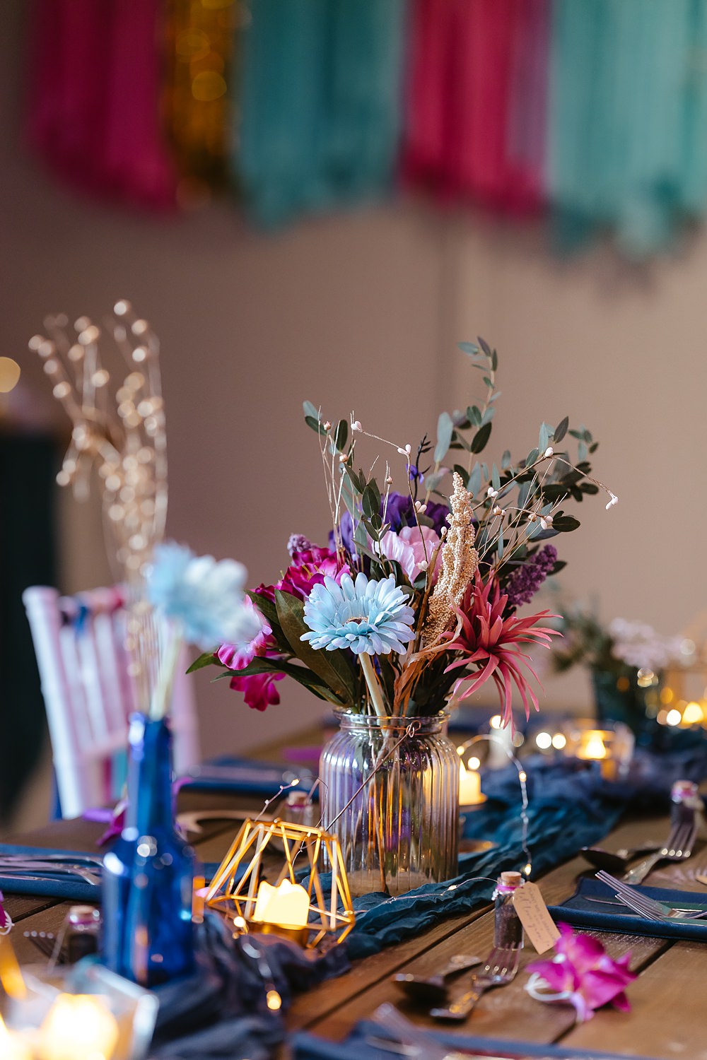 Stables at Ffolkes Wedding Cherrelle Blake Photography Table Decor Colourful Pink Blue Purple Flowers Candles Runner