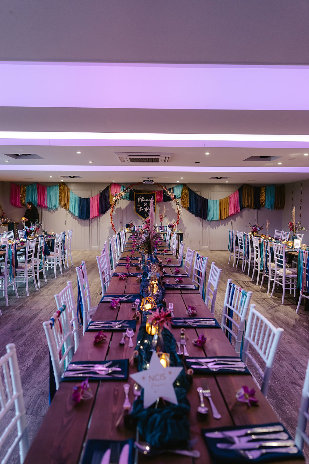 Stables at Ffolkes Wedding Cherrelle Blake Photography Table Decor Colourful Pink Blue Purple Flowers Candles Runner