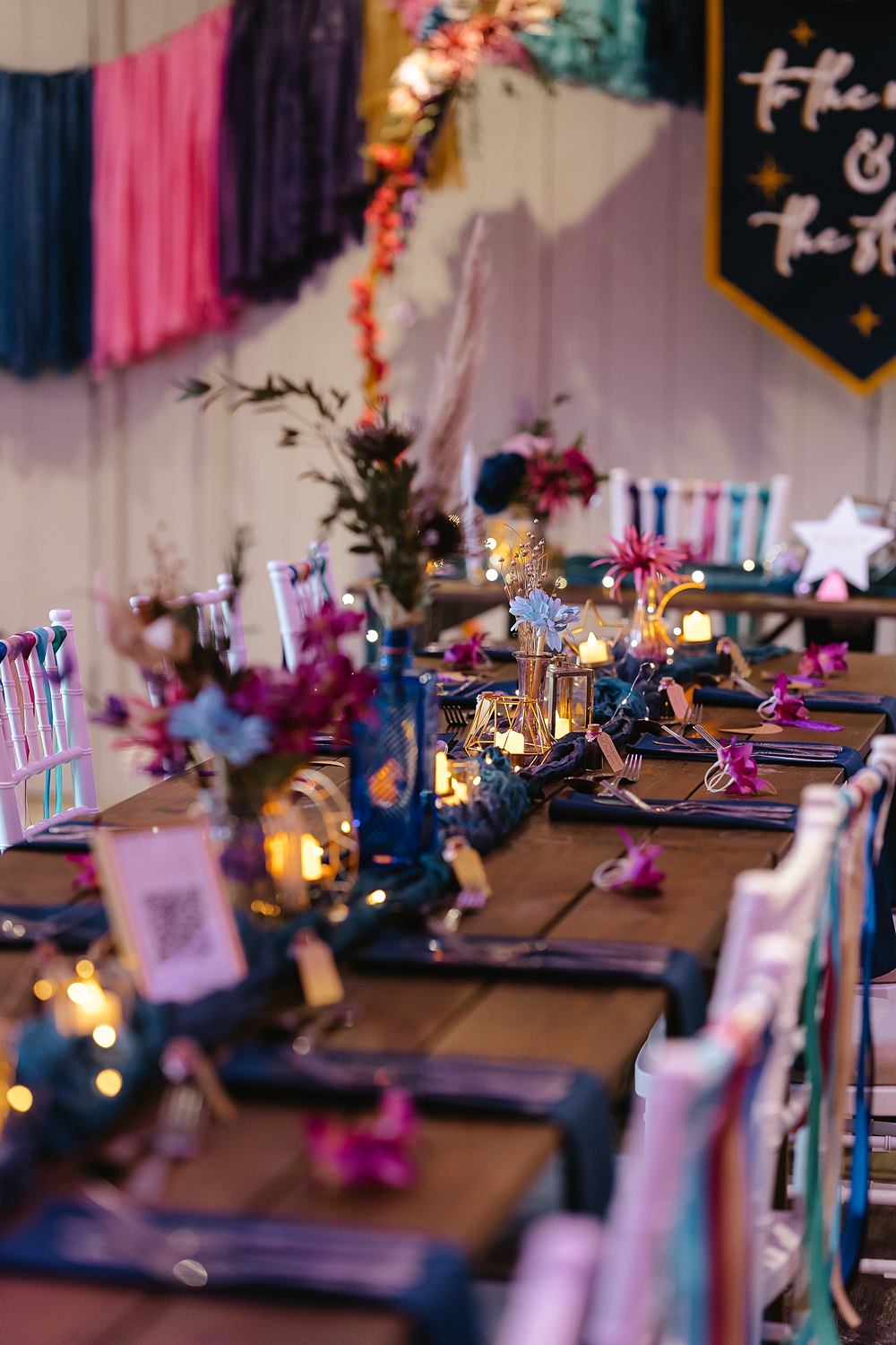 Stables at Ffolkes Wedding Cherrelle Blake Photography Table Decor Colourful Pink Blue Purple Flowers Candles Runner
