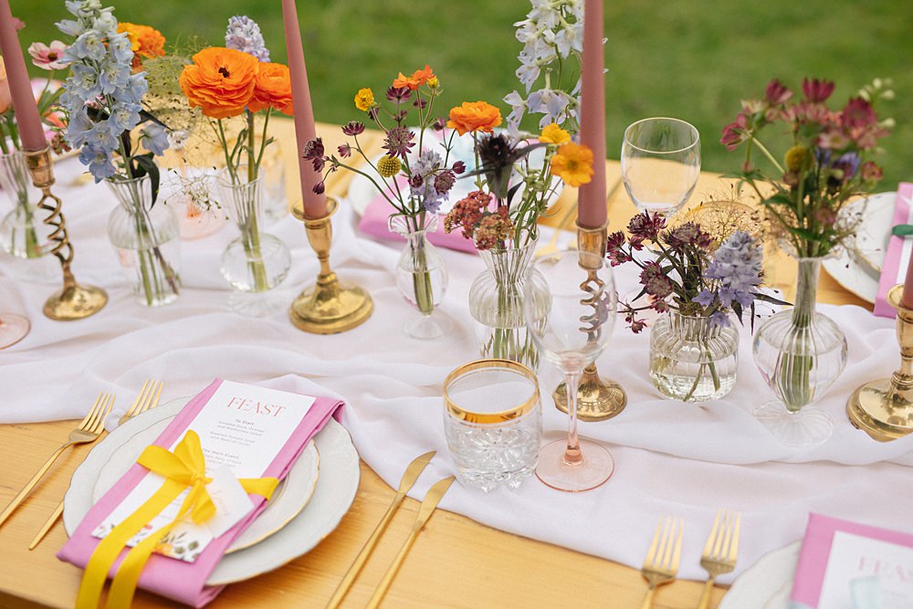 Weddings At Woodfords Max Turner Weddings Wooden Table Colourful Wildflowers Flower Bottles Tall Candles Gold Decor
