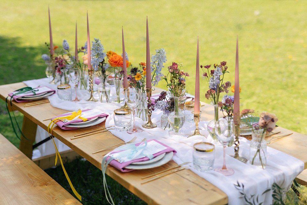 Weddings At Woodfords Max Turner Weddings Wooden Table Colourful Wildflowers Flower Bottles Tall Candles Gold Decor