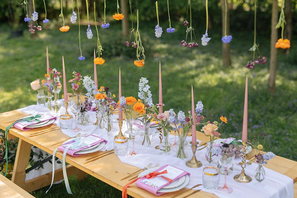 Weddings At Woodfords Max Turner Weddings Wooden Table Colourful Wildflowers Flower Bottles Tall Candles Gold Decor
