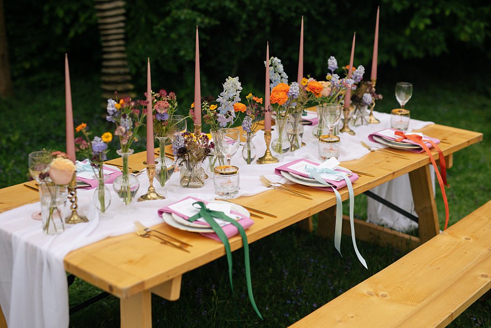 Weddings At Woodfords Max Turner Weddings Wooden Table Colourful Wildflowers Flower Bottles Tall Candles Gold Decor