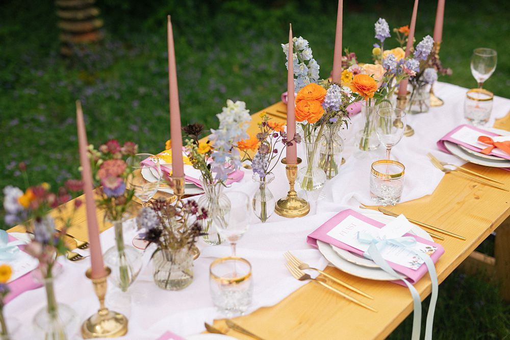 Weddings At Woodfords Max Turner Weddings Wooden Table Colourful Wildflowers Flower Bottles Tall Candles Gold Decor