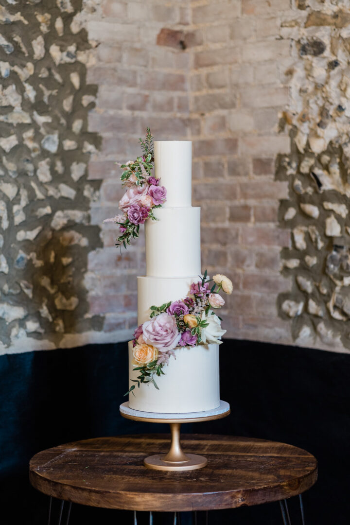 White Iced 4 Tier Spring Cake Flowers Wedding Gemma Giorgio Photography