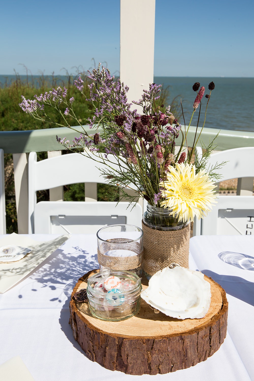 Kent Seaside Wedding Hannah Larkin Photography Centrepiece Flowers Twine Jars Log Slice