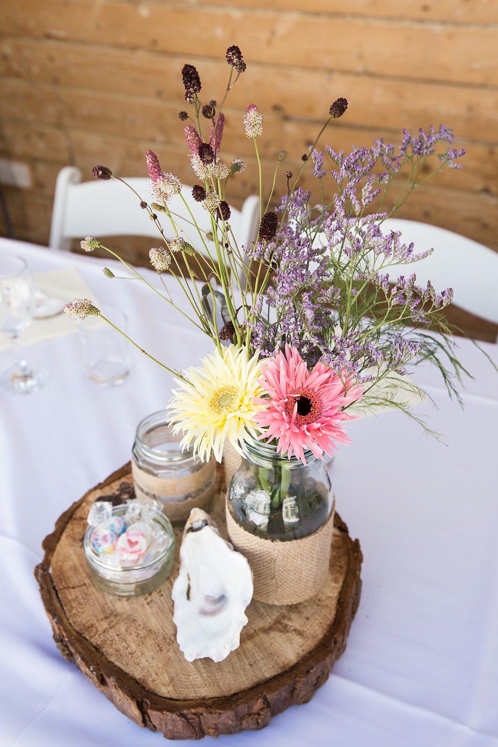 Kent Seaside Wedding Hannah Larkin Photography Centrepiece Flowers Twine Jars Log Slice