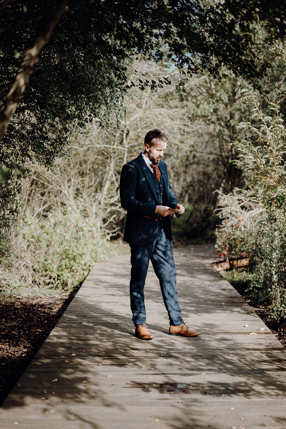Royle Forest Wedding Bligh and Guy Wedding Visuals Blue Suit Orange Tie Groom