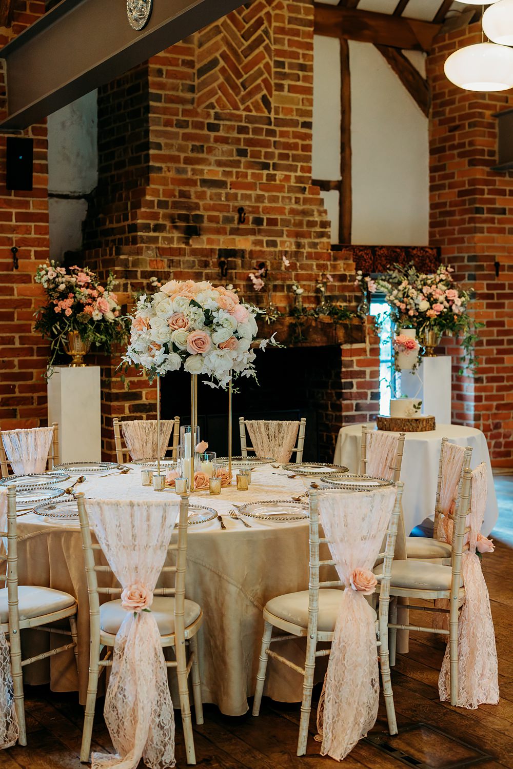 Summer Blush Wedding NK Photography Round Tables Tall Centrepiece Flowers Chair Sash