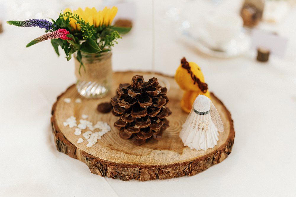 Aswanley Wedding Beth Sutton Photography Centrepiece Log Slice Pine Cone Jar Flowers